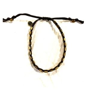 Tai single strand gold and brown bracelet